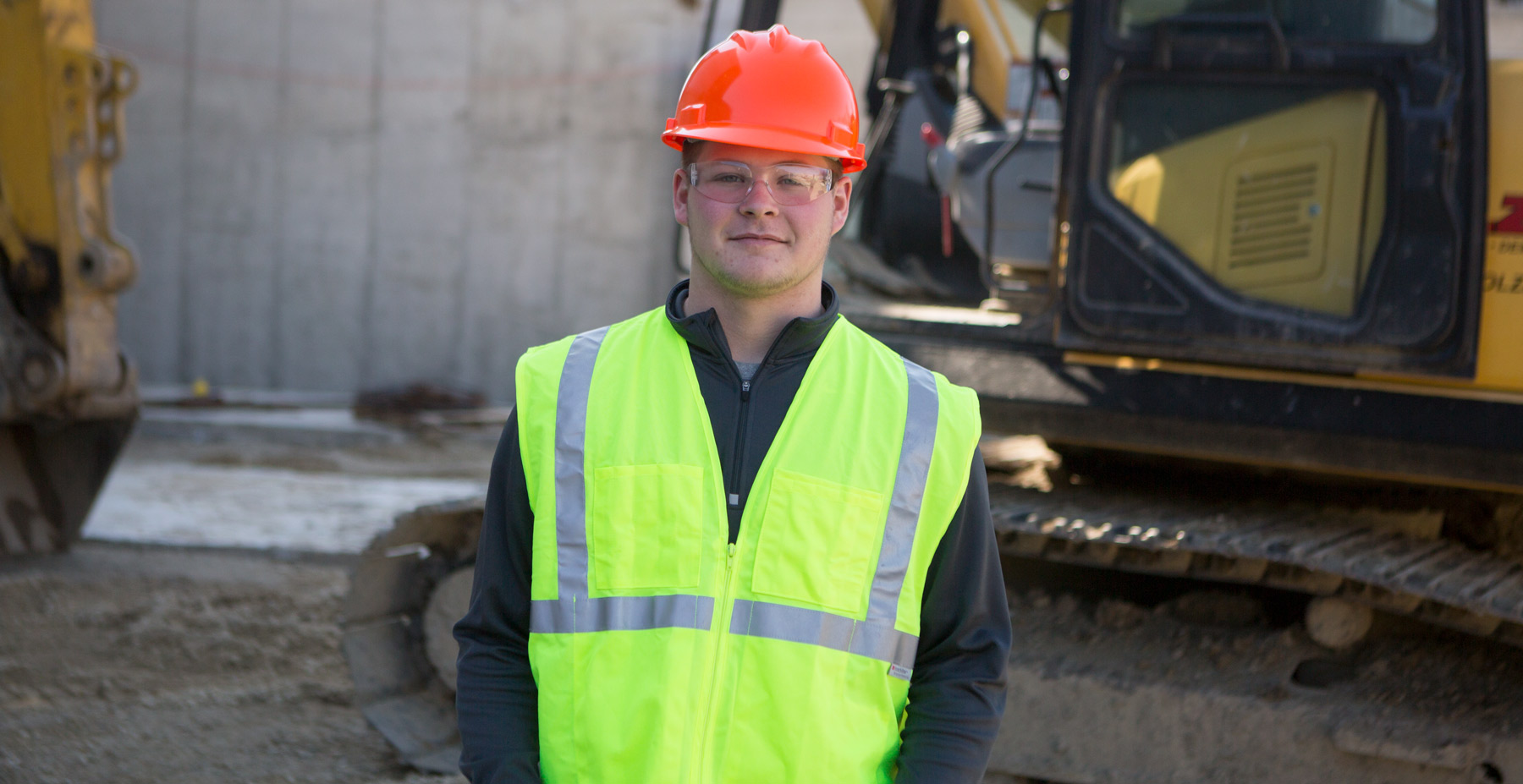 Student is photographed on a construction site.