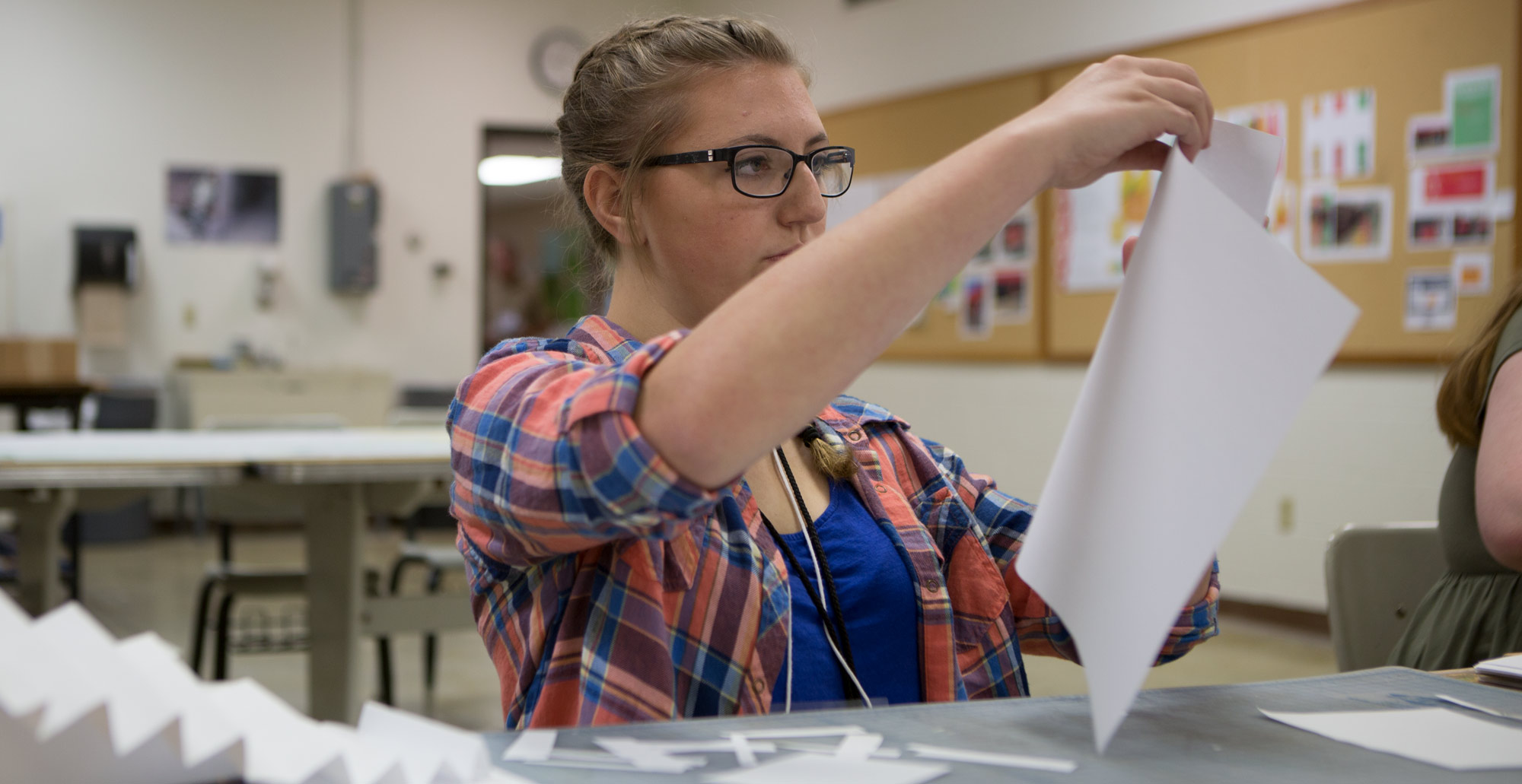 High school student works during a summer art and design course.