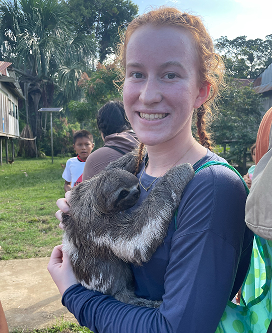 Hall - Madeline holding Maria, the sloth. “The children at the Yagua village wanted us to hold their pets.”