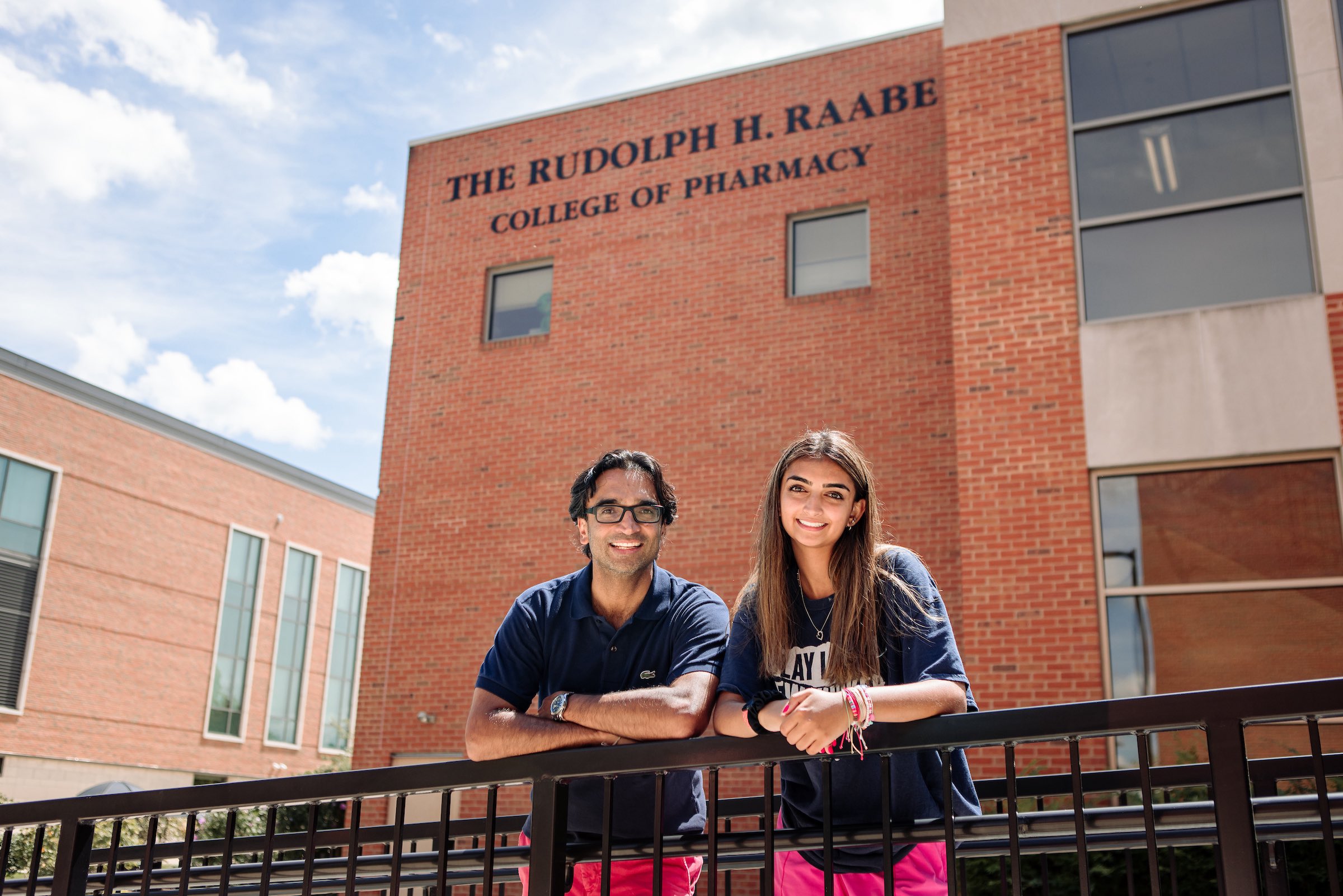 Mayha Jobanputra and her father, Poshin, outside the Raabe College of Pharmacy at Ohio Northern University.