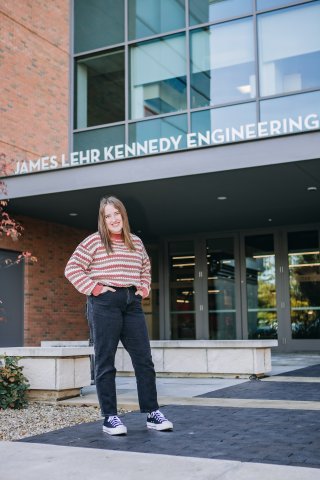 Photo of Sarah in front of Engineering building