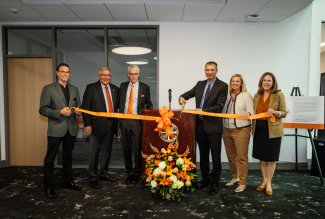 Kokosing, Inc. and Ohio Northern University leaders cutting the ribbon at an engineering department naming ceremony.