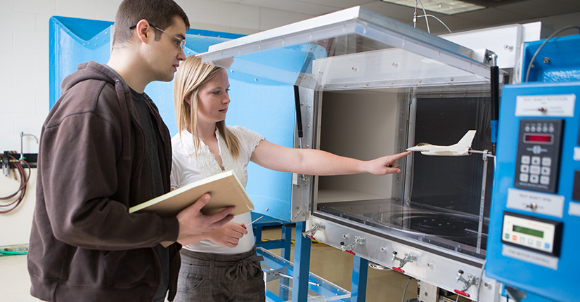 Students work with the engineering equipment