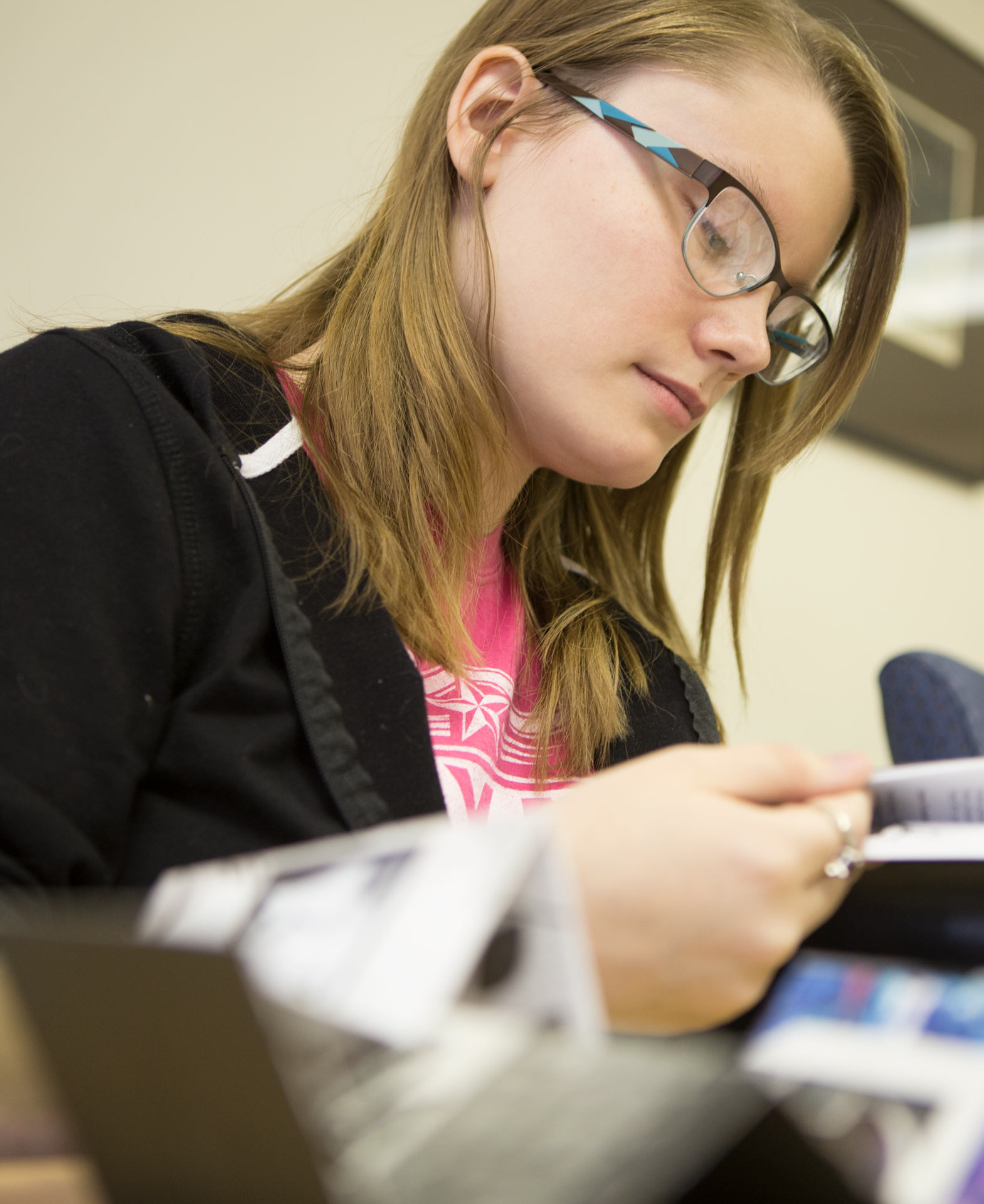 Communications studies student working on a project