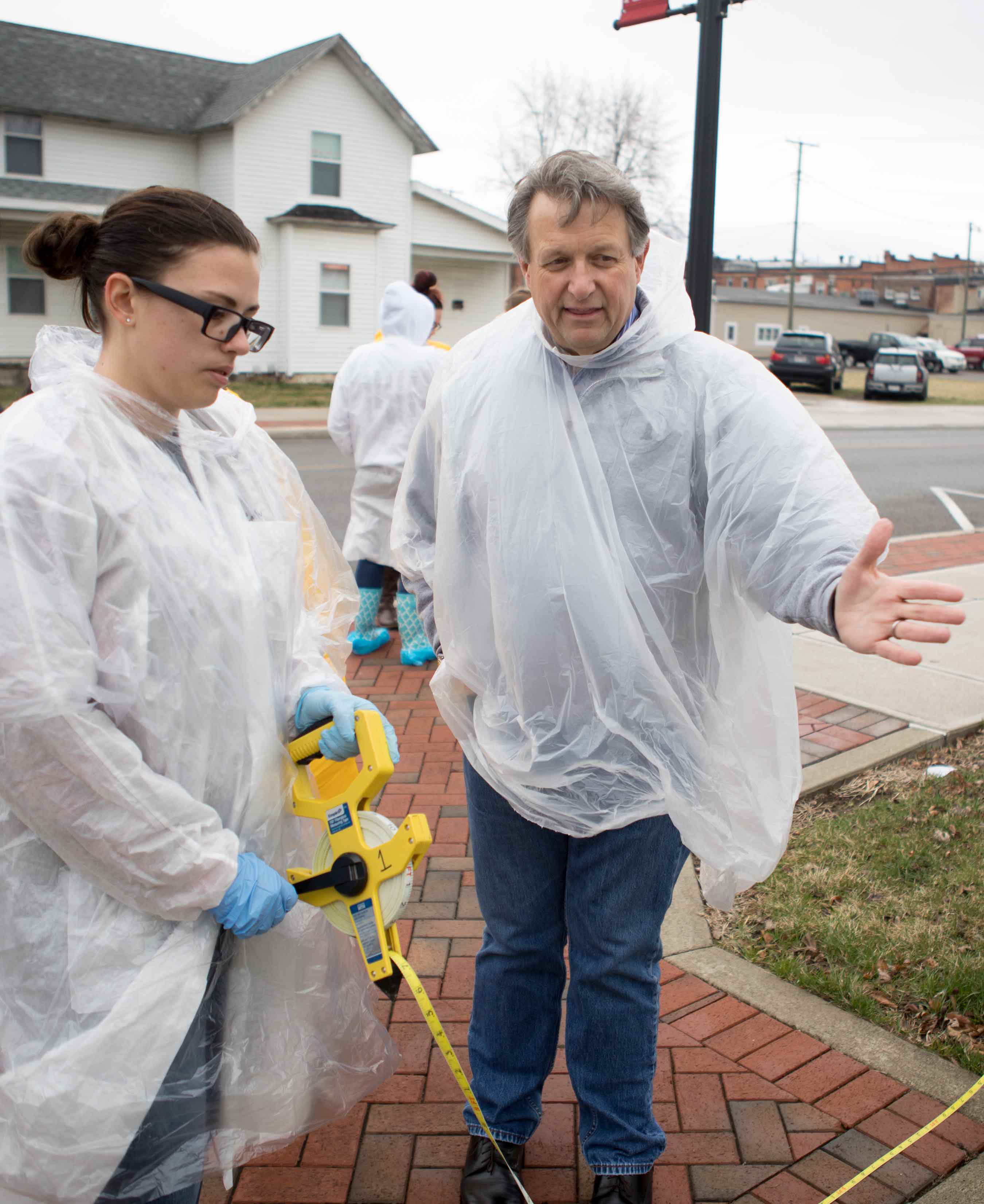 forensic biology professor and students at crime house