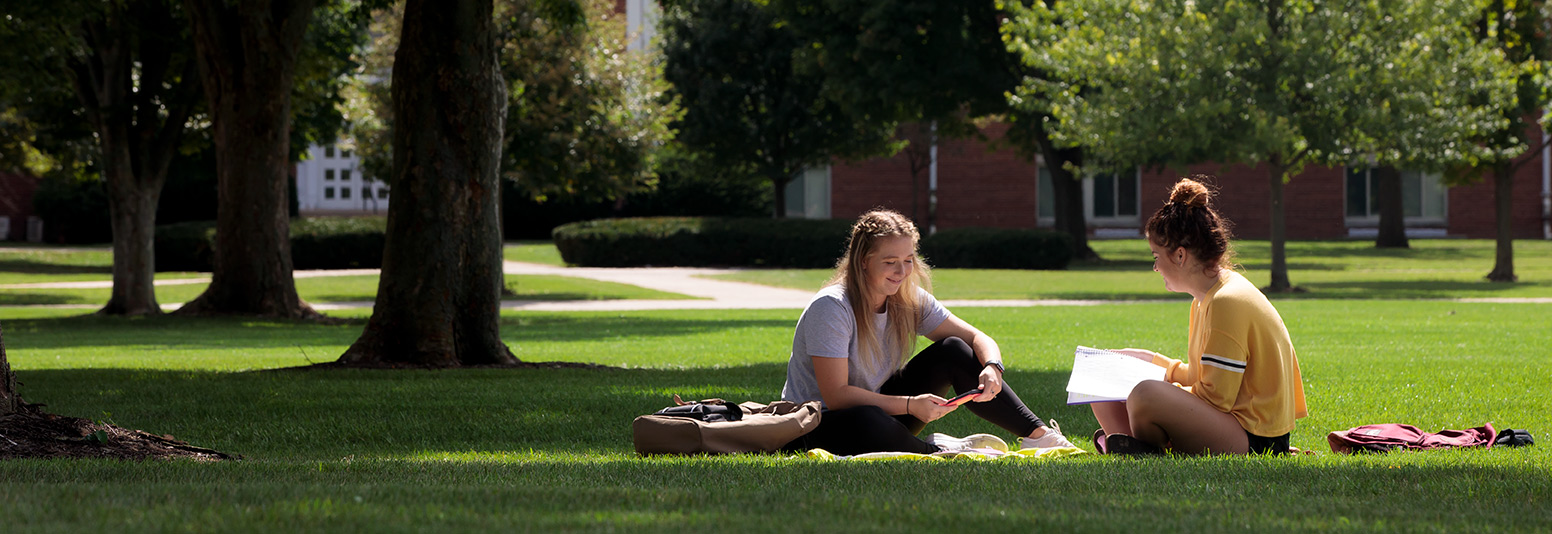 Enjoying the warm sun outside of Lima Hall