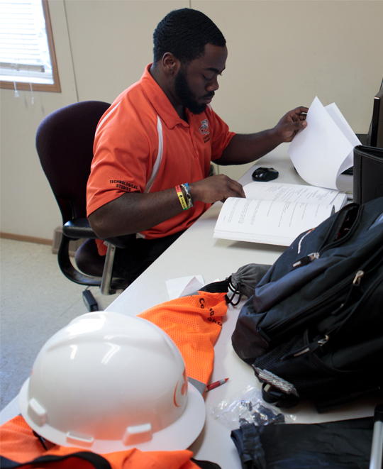 Construction management student working on a project