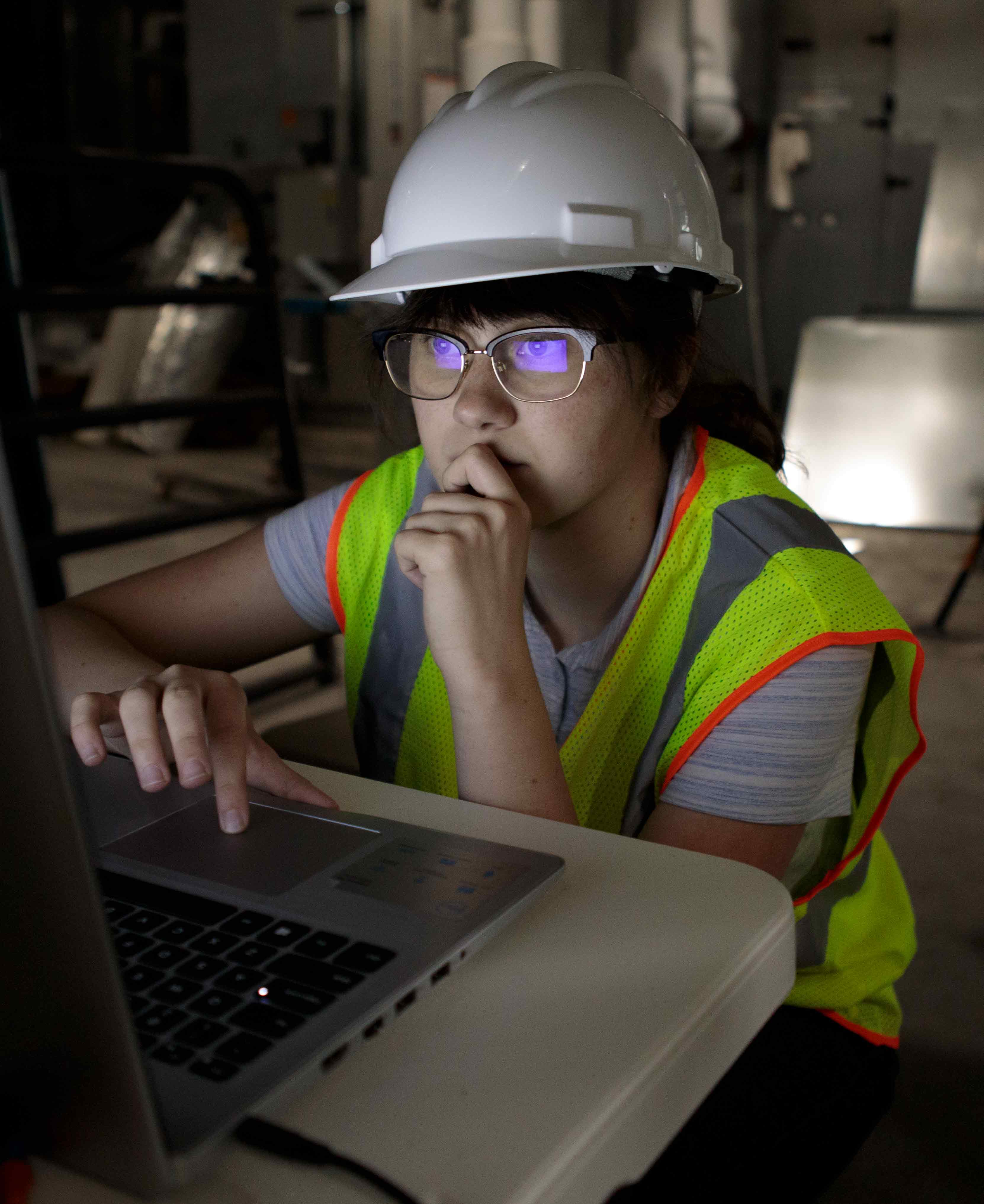 Construction management student on a laptop