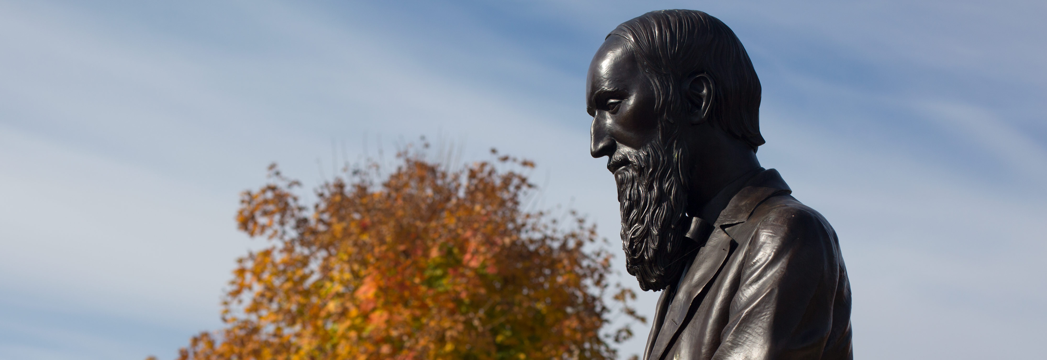 Changing leaves surround the statue of H.S. Lehr at Ohio Northern University