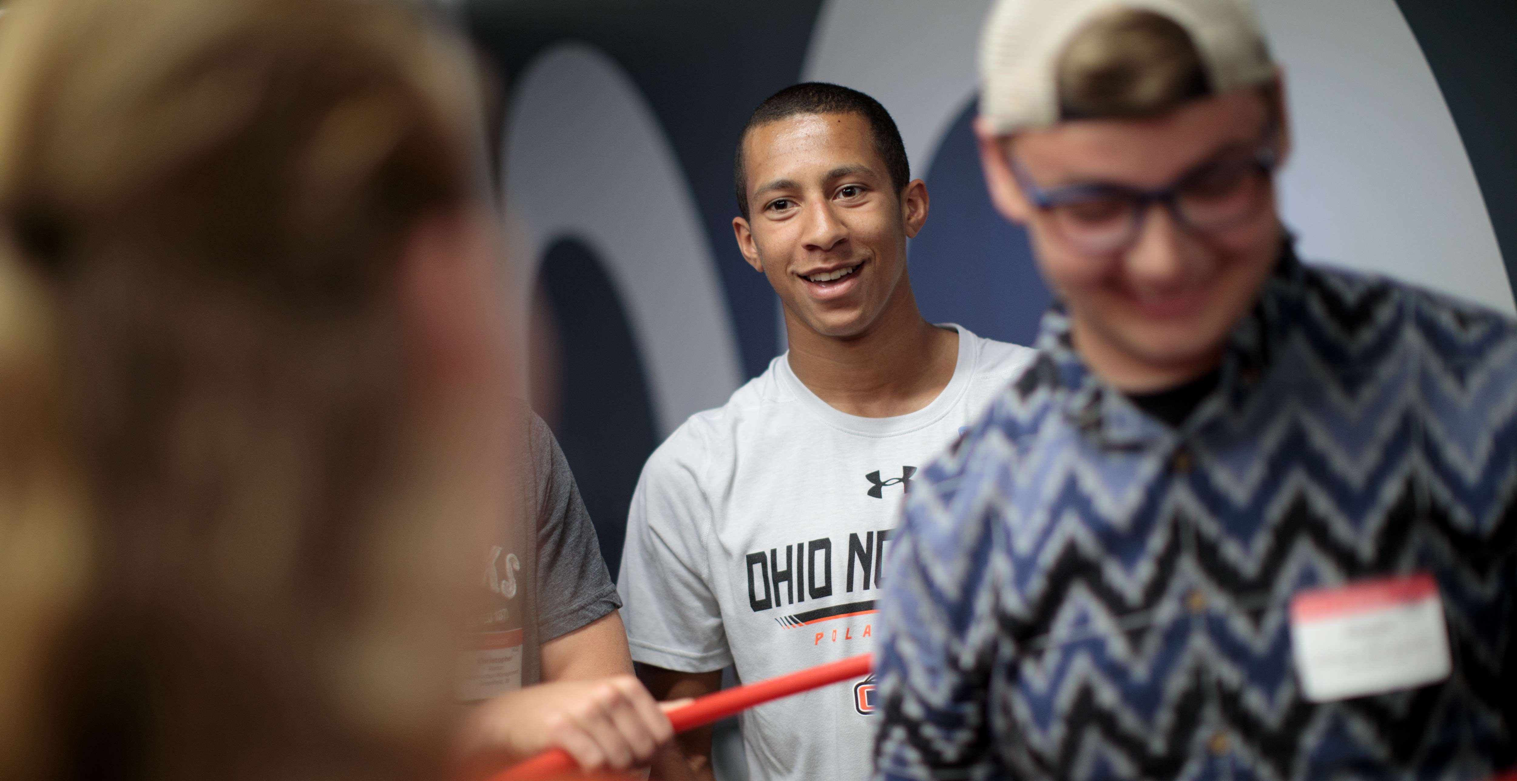 Student competes in a group activity during orientation