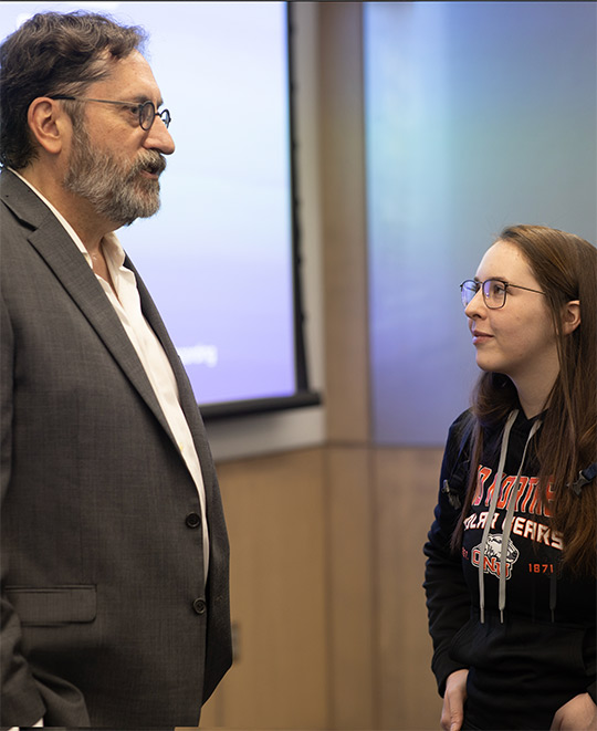 Bob Peterson talking with students