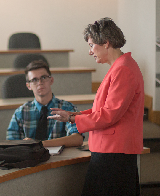 Professor talking to student