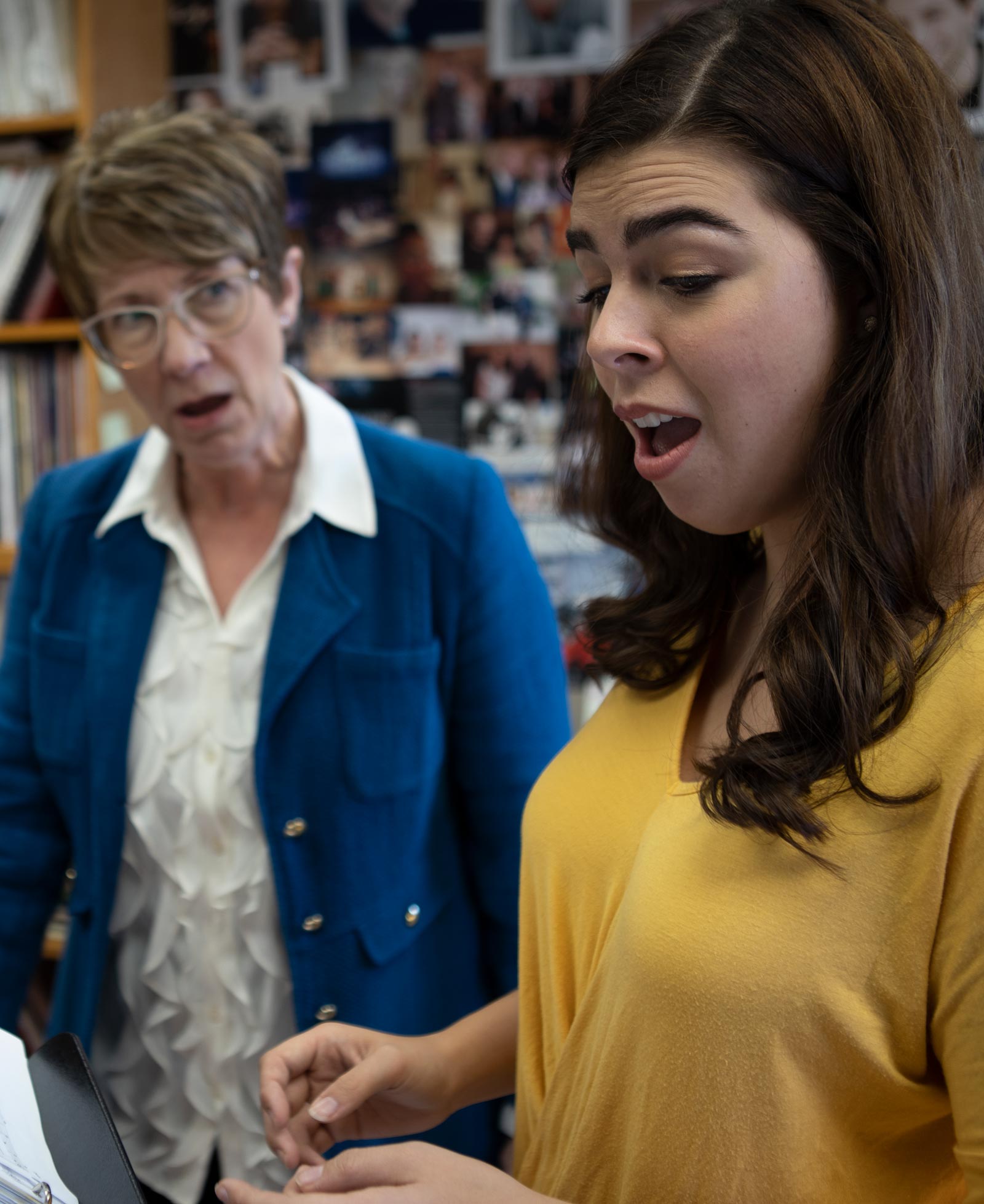 Kirsten Osbun-Manley, lecturer in music and musical theatre, with senior Emily Estep singing in her office in Presser Hall