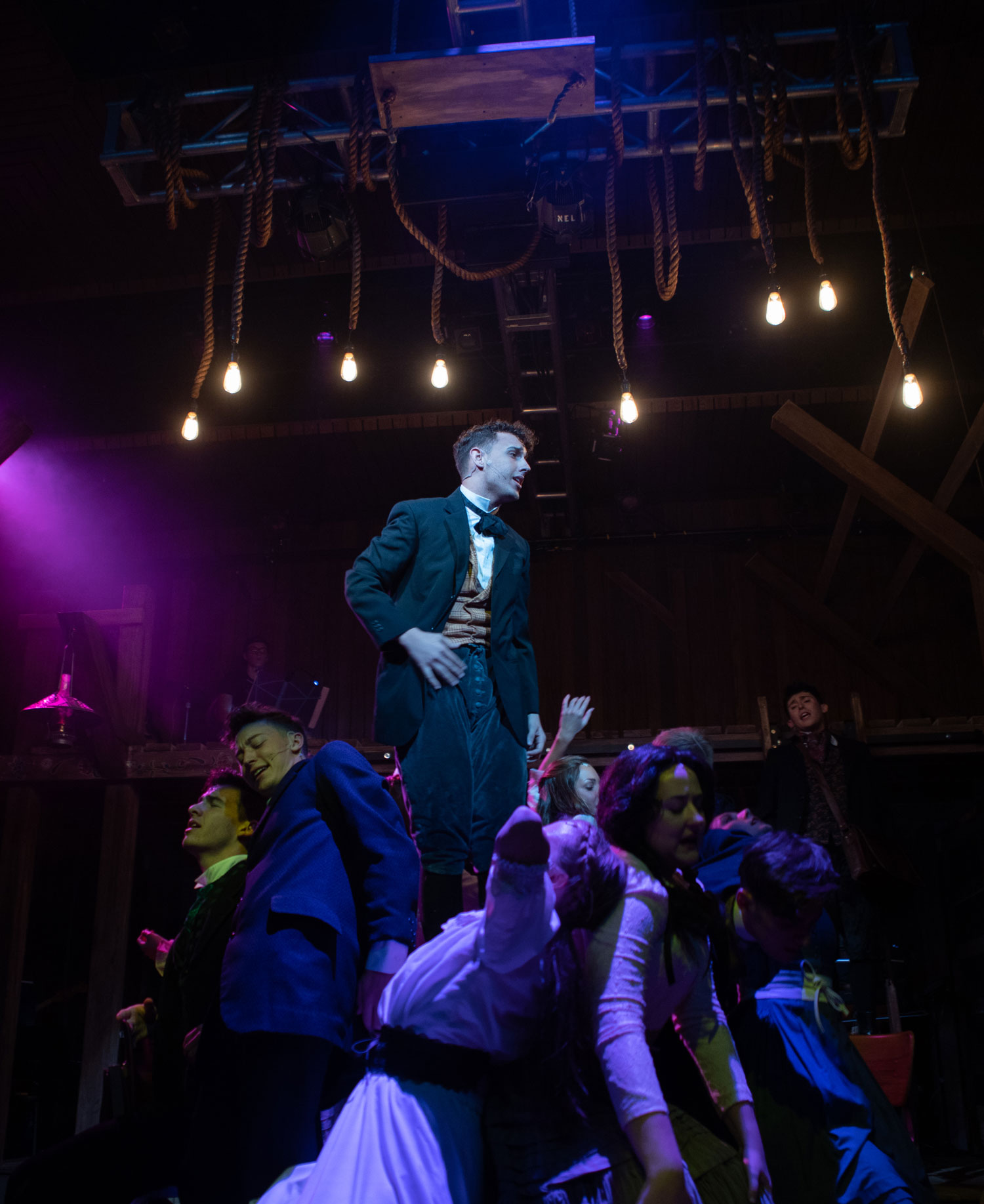 musical theatre students perform on stage for spring awakening. 