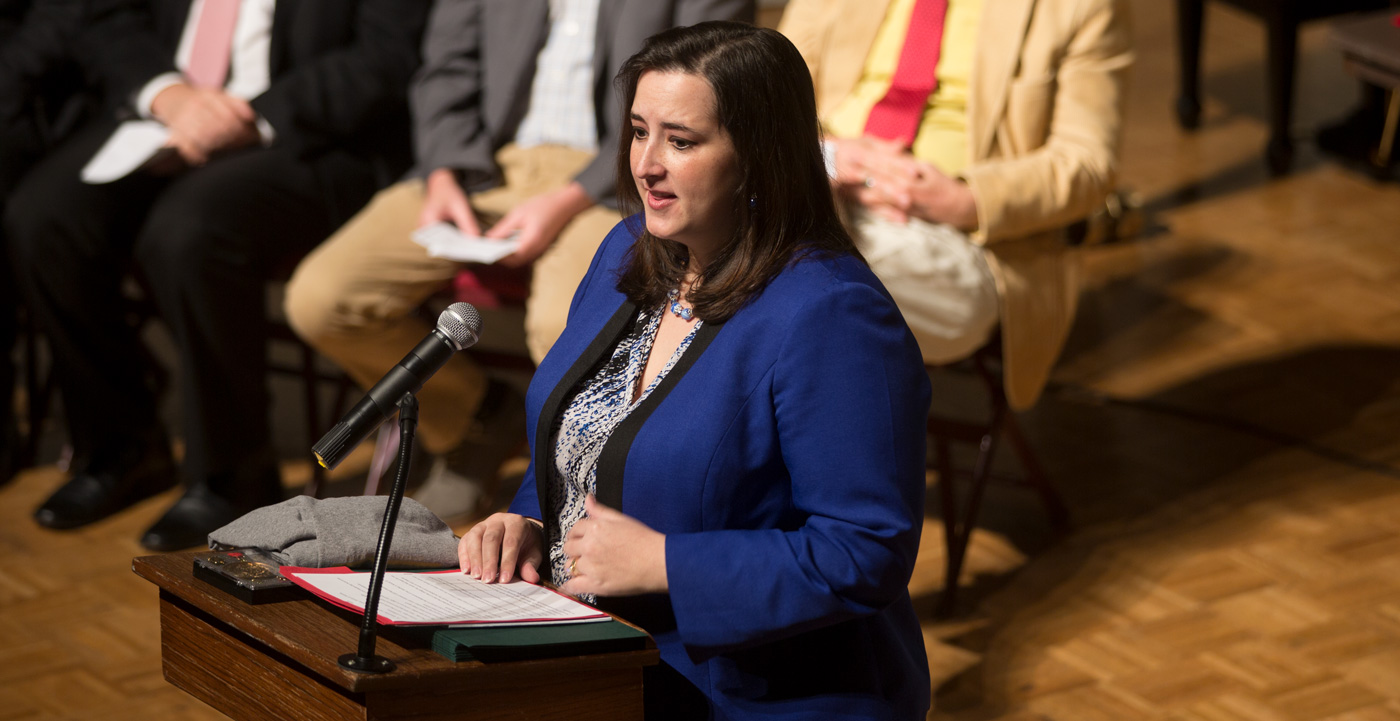 Graduate speaker talked to a crowd of students during honors day.