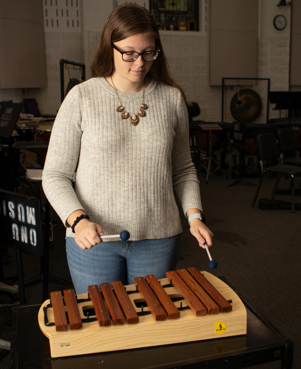 Student studies integrated music methods during a music education class.