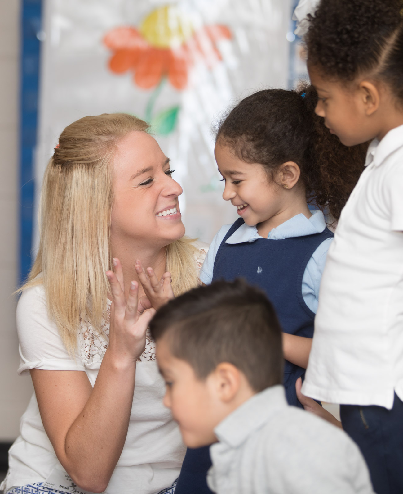 Student teach elementary kids at school. 