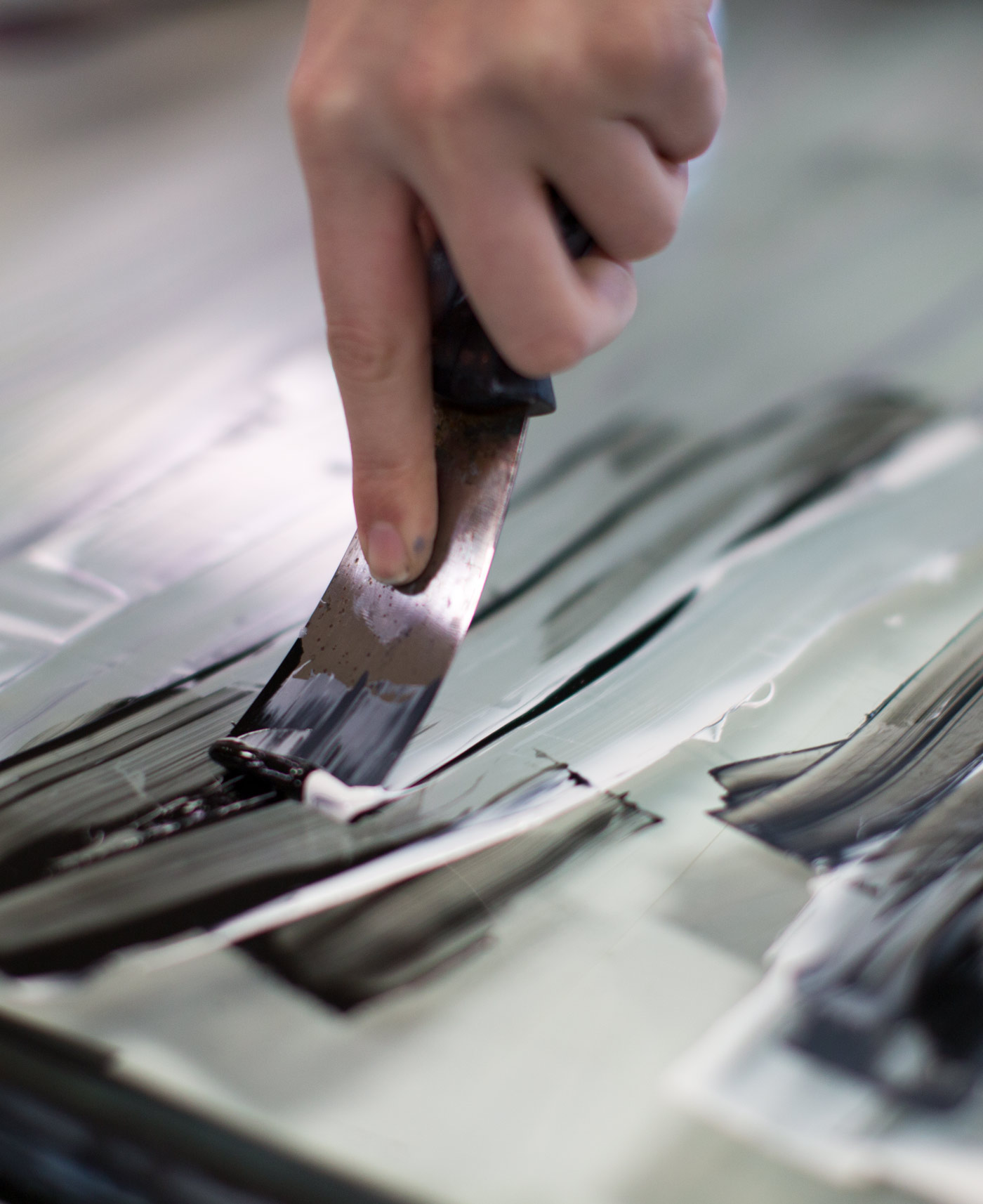 Caitlyn Busch cleans ink after relief printing at Wilson Art Building. The Ohio Northern University senior was working on a final project.