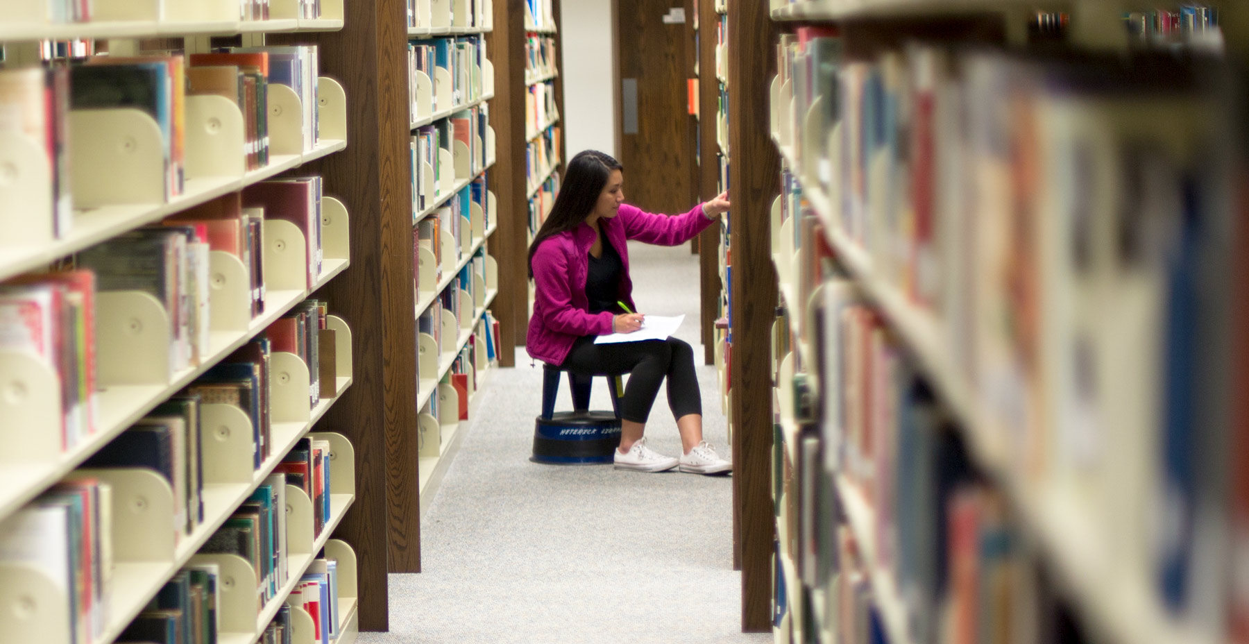 Senior Rachel Chen, student library assistant, checks inventory on the third floor of Heterick Memorial Library at Ohio Northern University.