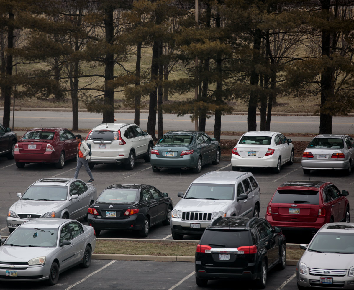 A student walks from his parking space to the Ohio Northern University College of Pharmacy.