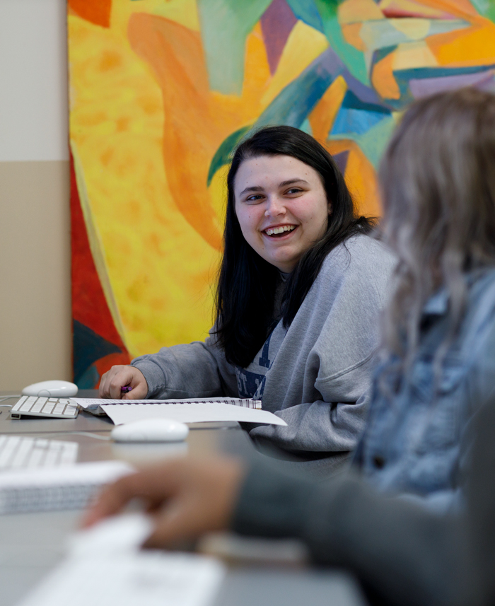 graphic design students working in the computer lab.