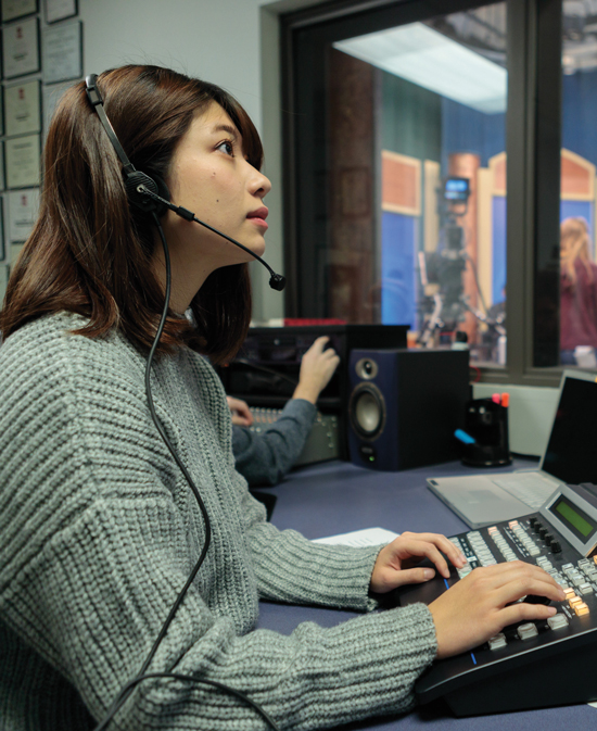 student woking in the ONU TV room.