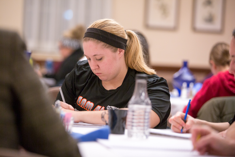 student creates a written piece in class.