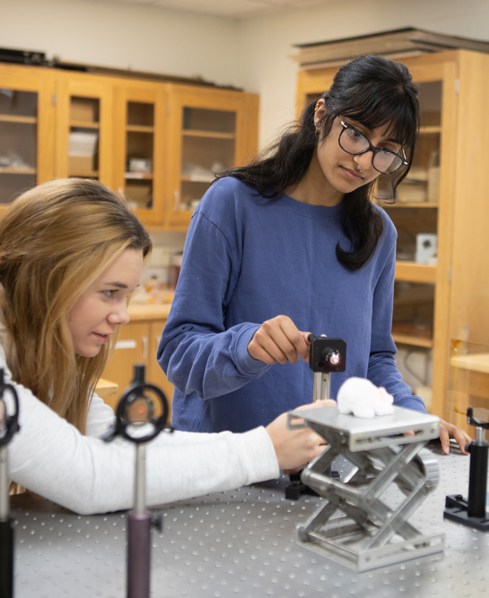 Physics students work in the lab.