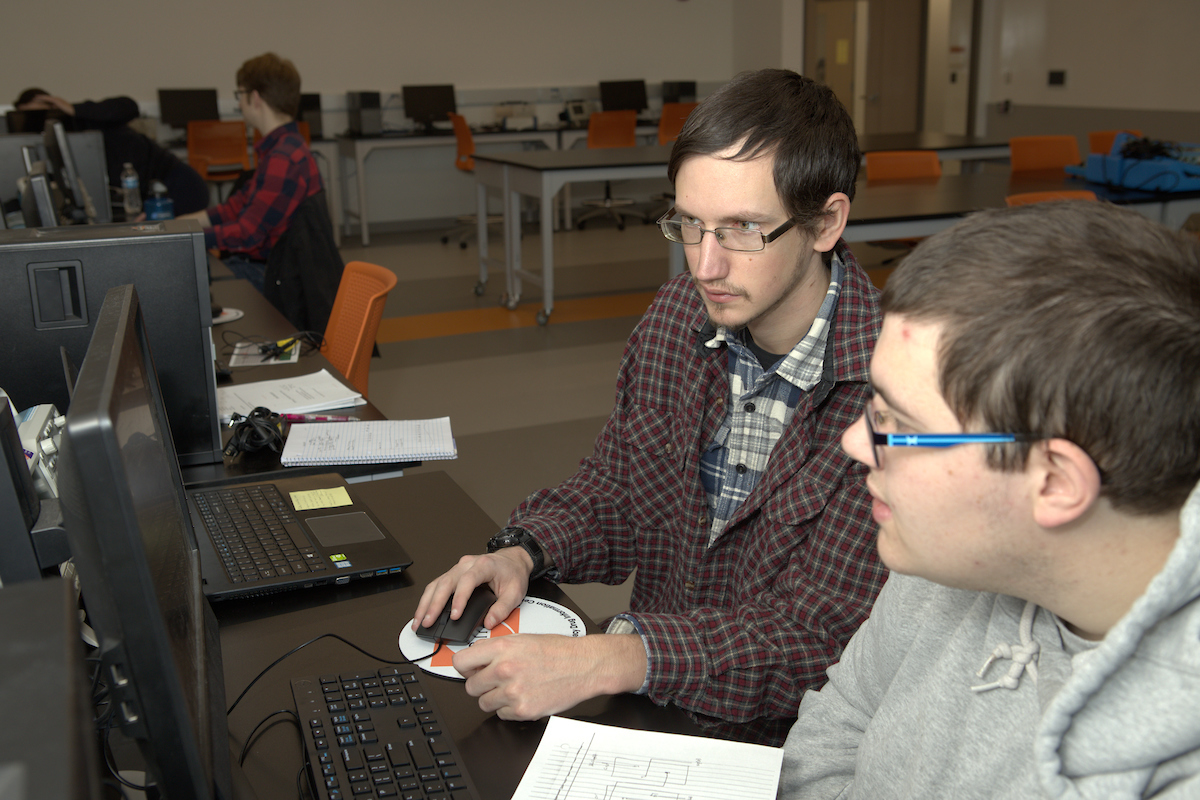 Students working hard in computer science class