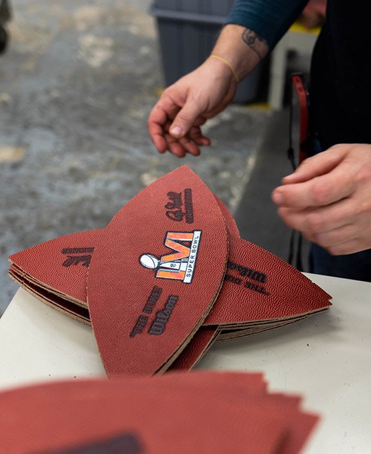 Football panels wait to be sewn