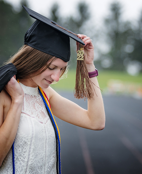 Graduation photo of Tessa on the track