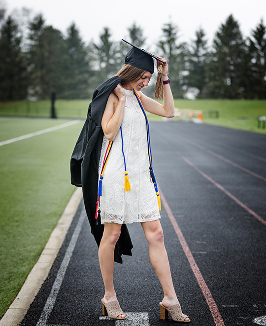 Graduation photo of Tessa on the track