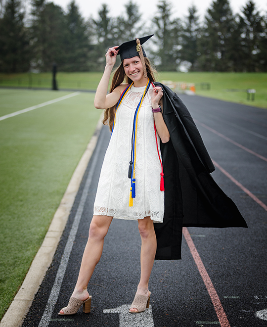 Graduation photo of Tessa on the track
