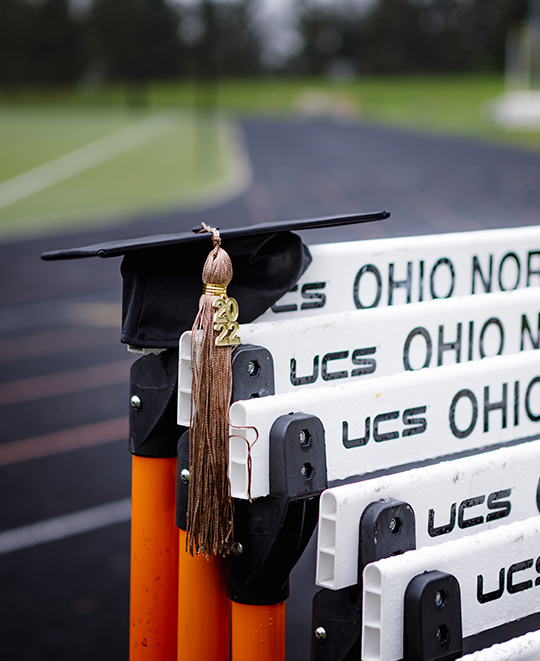 Graduation photo of Tessa on the track