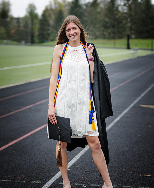 Graduation photo of Tessa on the track