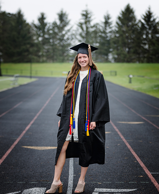 Graduation photo of Tessa on the track