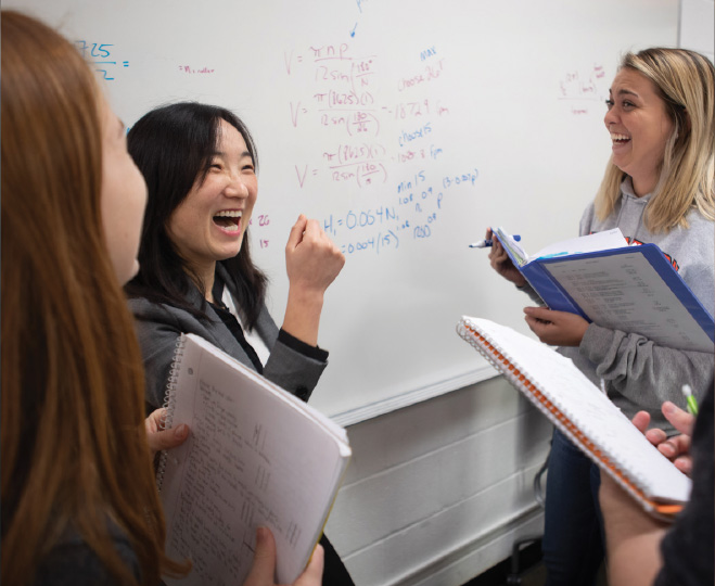 Students at white board