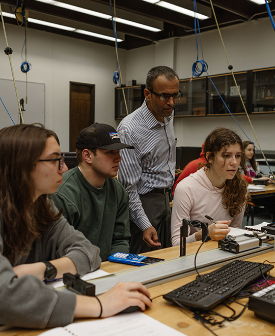 Physics students with instructor