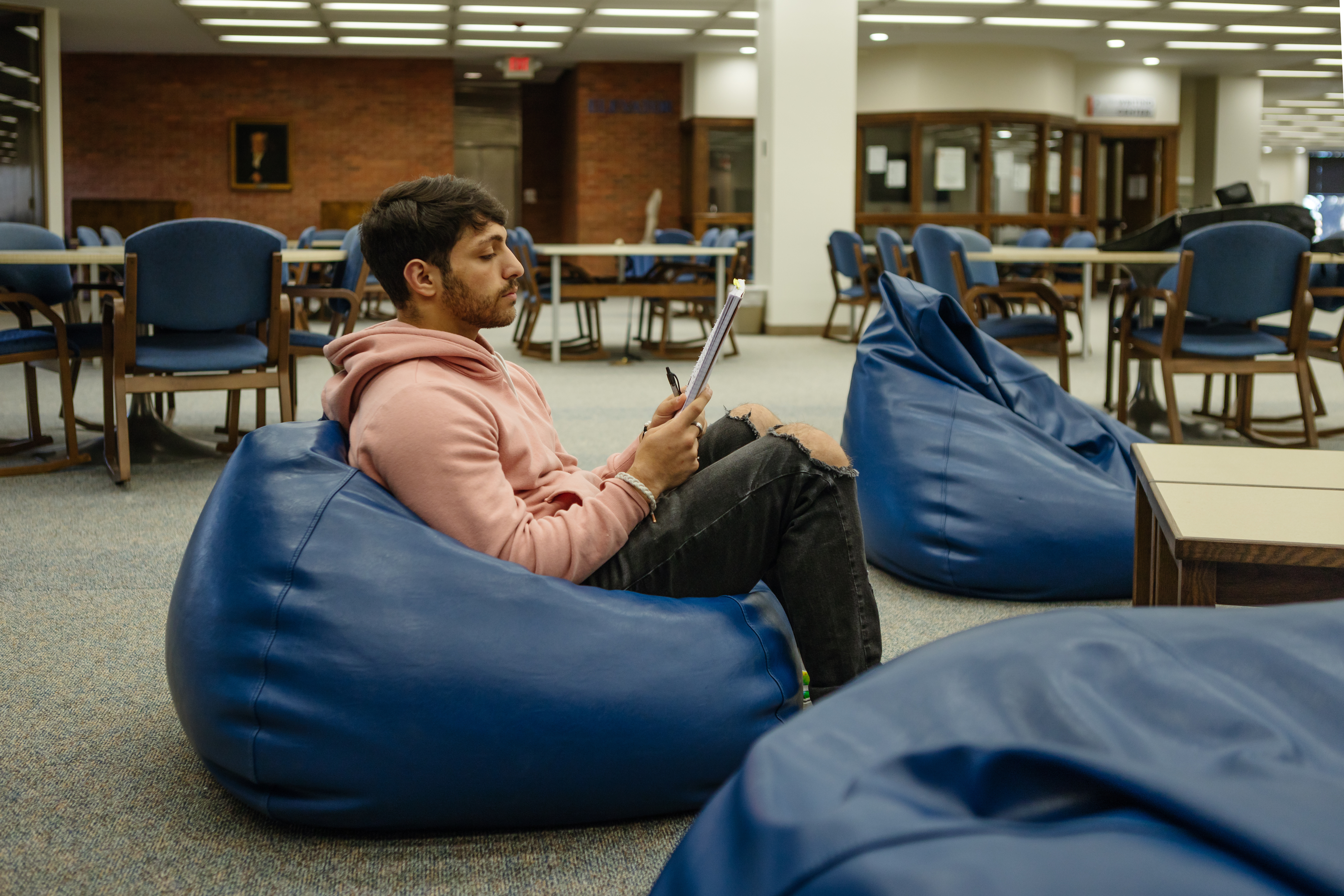 Photo of Karam sitting an bean bag chair