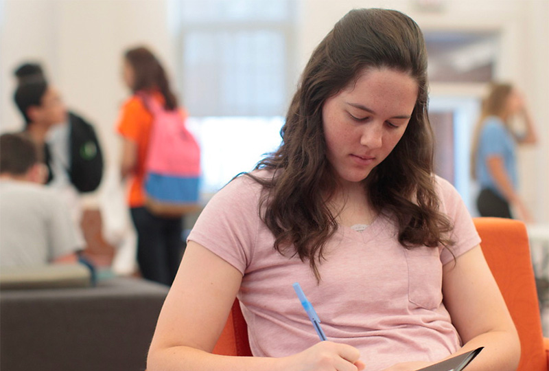 Photo of student seated studying