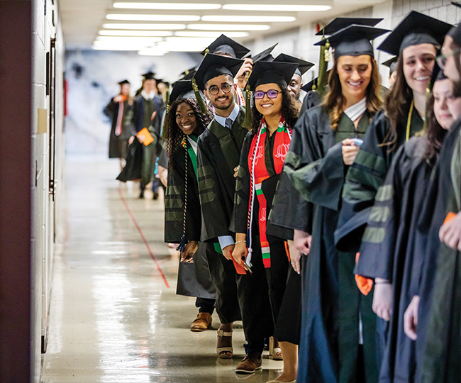Photo of a line of graduates