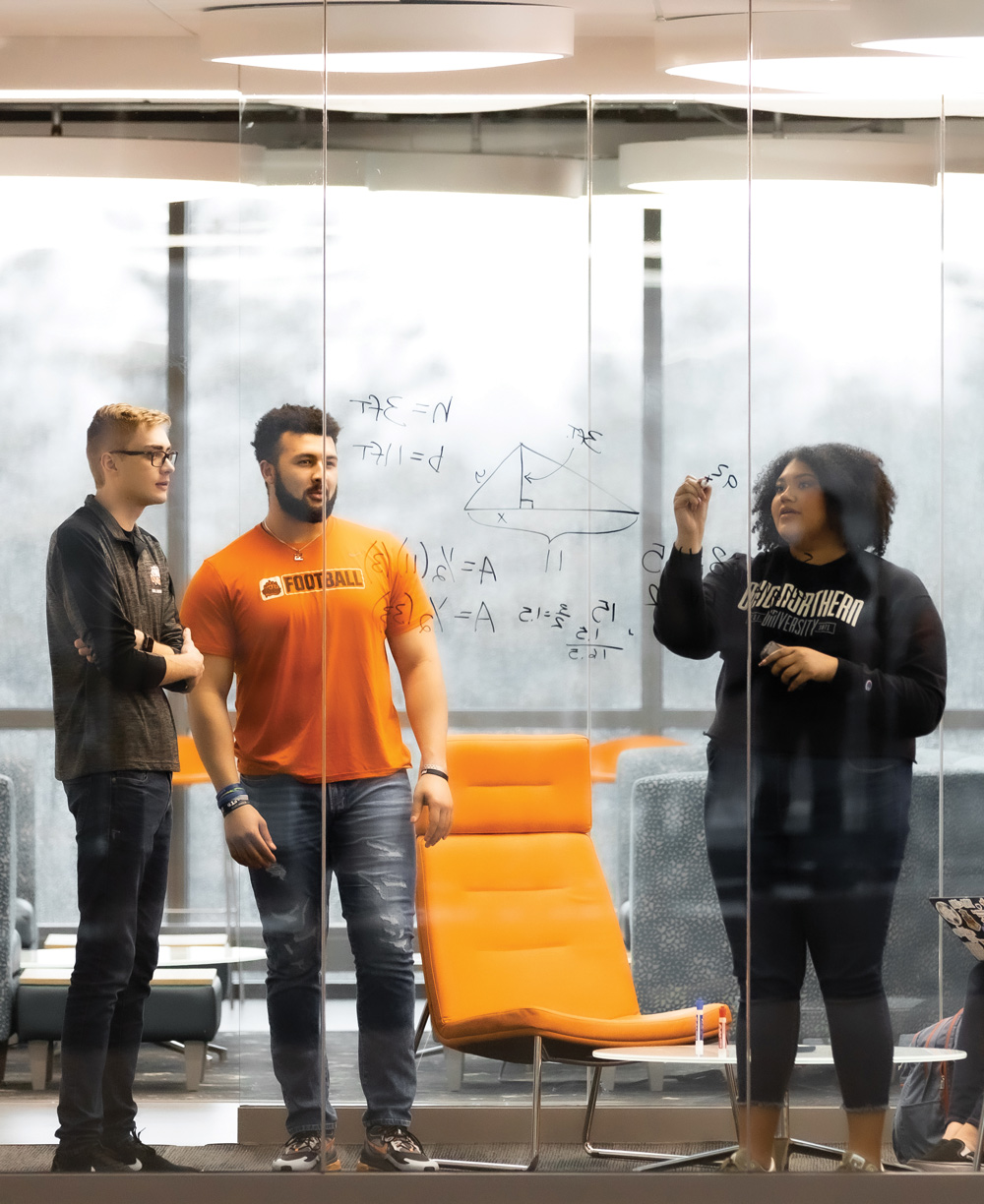 students studying in a huddle room