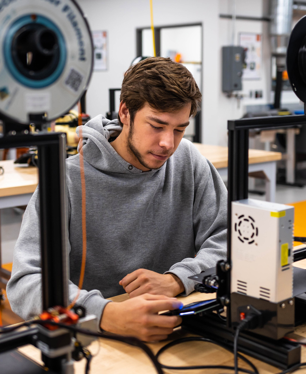 student using a 3D printer