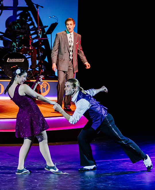 Students perform on stage during a rehearsal of Swing
