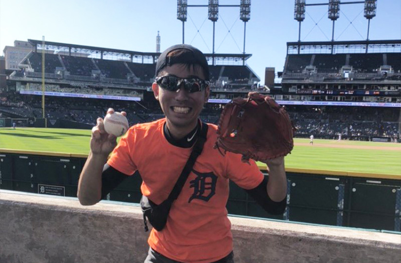 Photo of ONU student at a ball park with a baseball