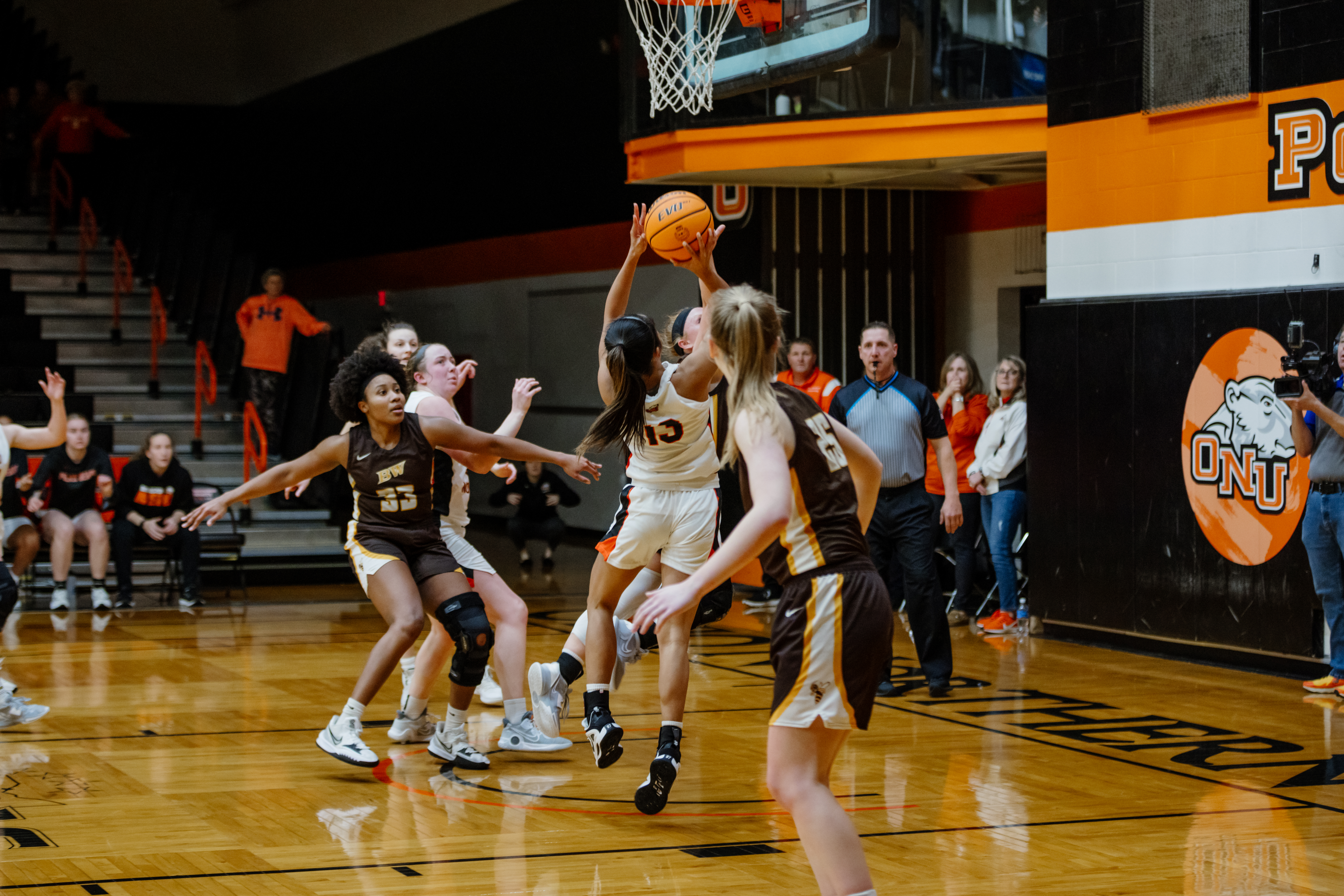 Photo of Abi playing basketball