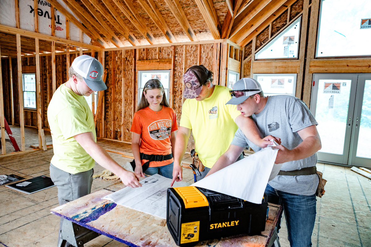Students working at a house