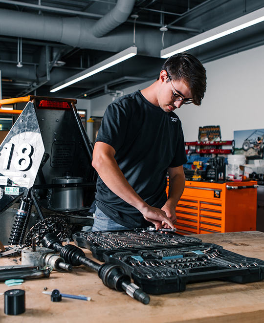 Photo of Mechanical Engineering Student working on class project