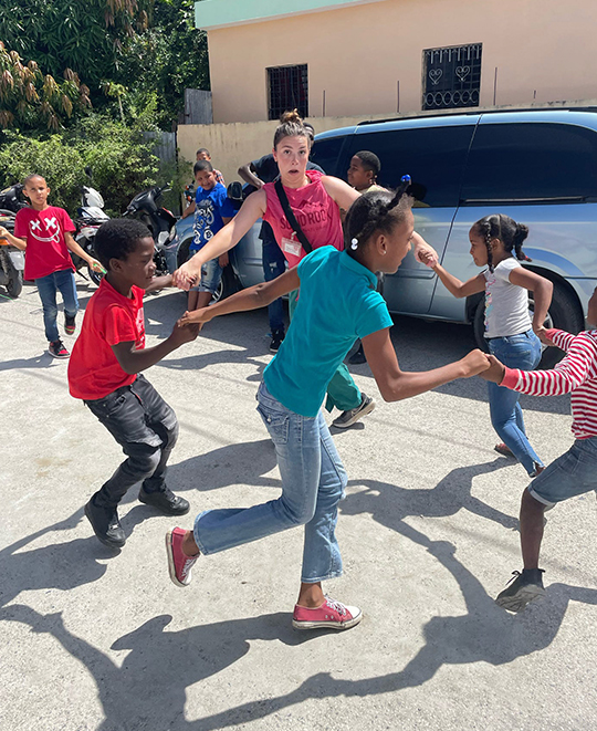 ONU Nursing student playing with local children
