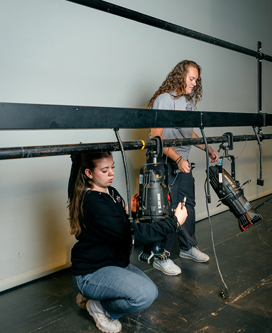 ONU Theater Production Students setting up lights for a show
